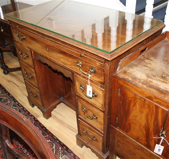 A George III mahogany kneehole desk with brushing slide W.96cm